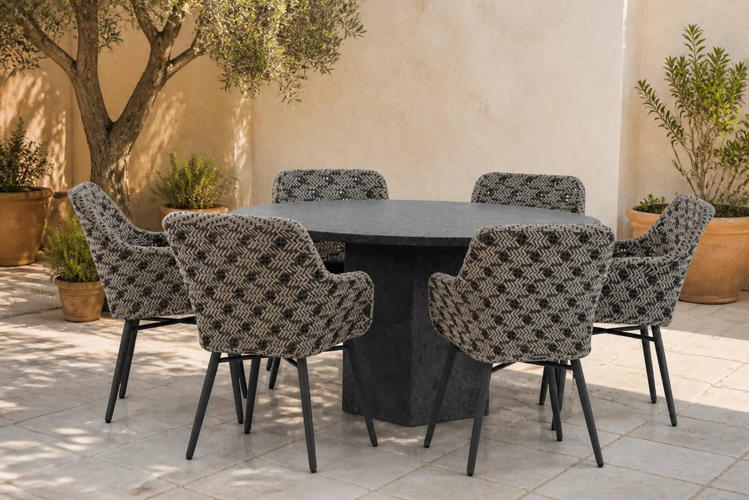 Sfeerfoto van Lifestyle Garden Furniture Crossway/Graniet 140 cm rond dining tuinset 7-delig – Zwart-wit