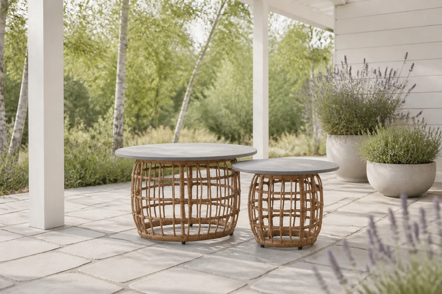 Sfeerfoto van BUITEN living Flow bijzettafel set van 2 | wicker + betonlook | 55cm + 75cm