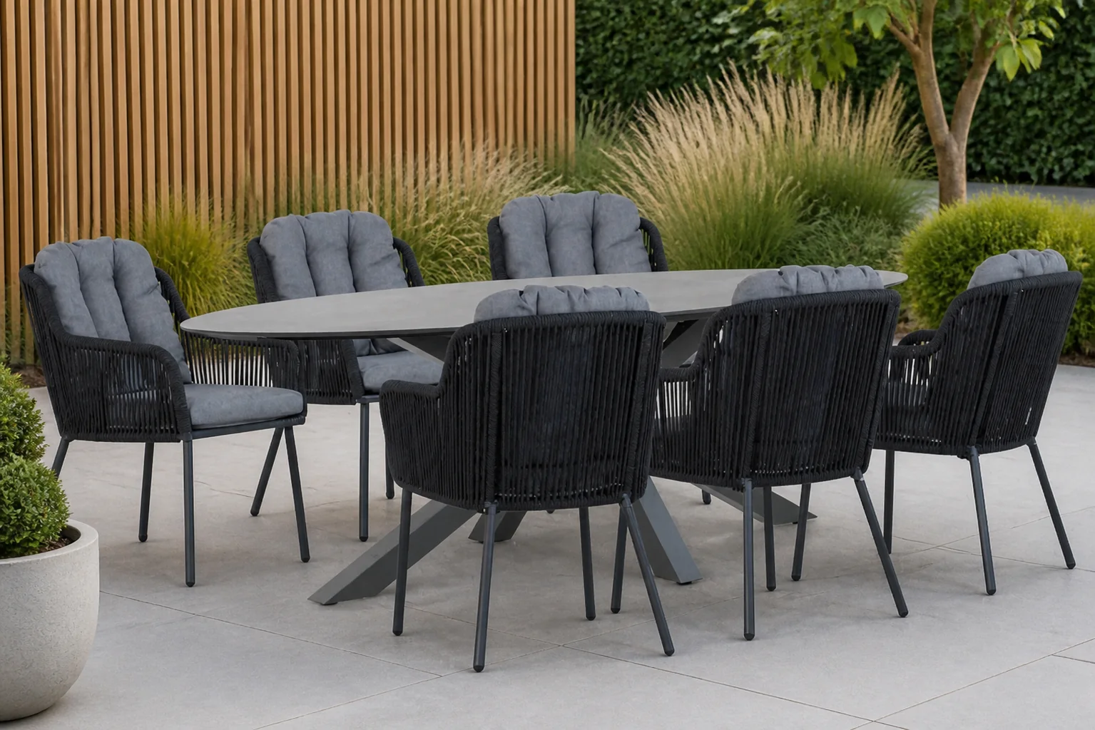 Sfeerfoto van Santika Furniture Tendenza/Ellisse 240 cm dining tuinset 7-delig – Grijs-antraciet