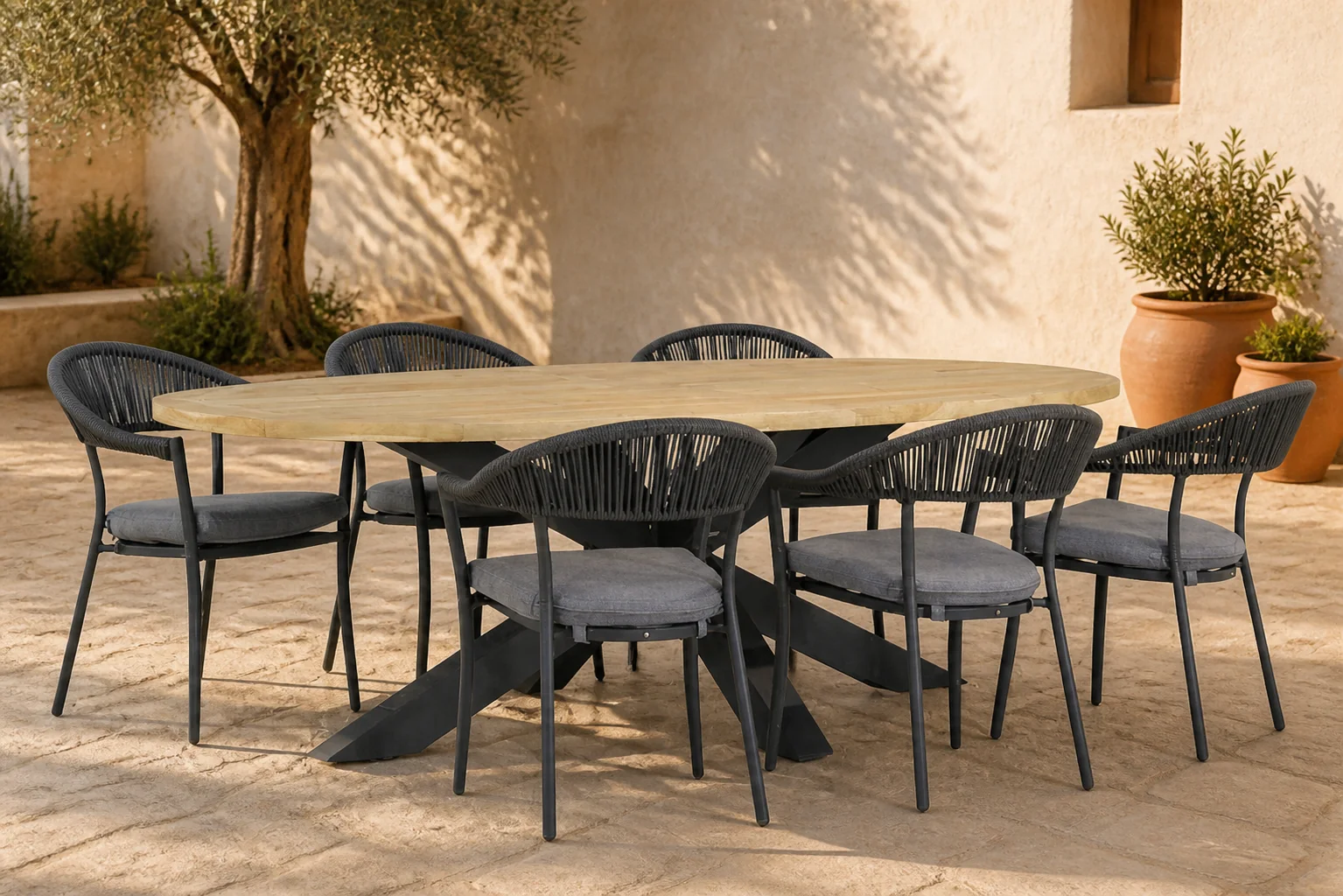 Sfeerfoto van Santika Furniture Vivian/Brookline 240 cm ovaal dining tuinset 7-delig – Grijs-antraciet