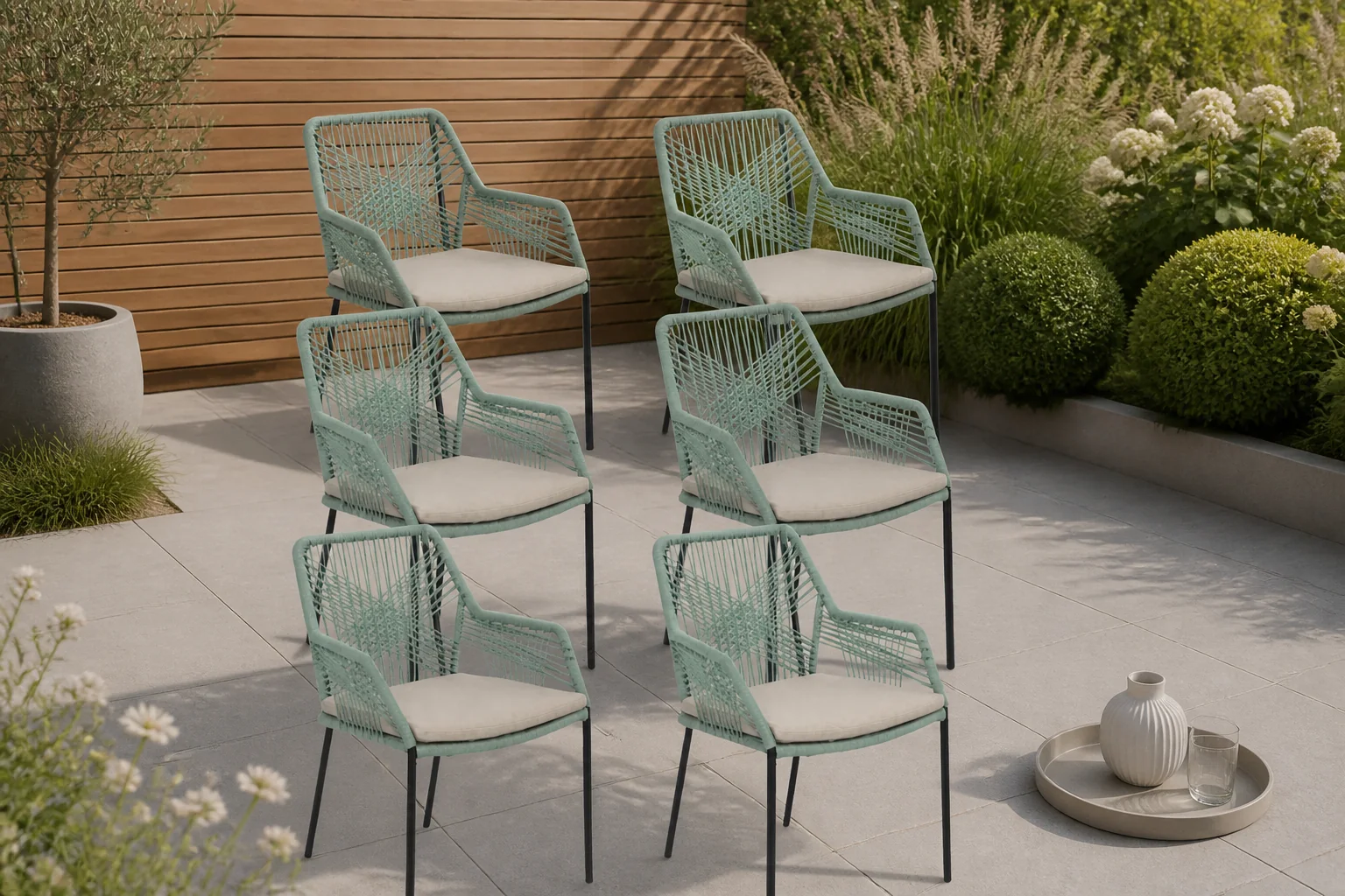 Sfeerfoto van BUITEN living Seville dining tuinstoel stapelbaar set van 6 | touw + staal | mint