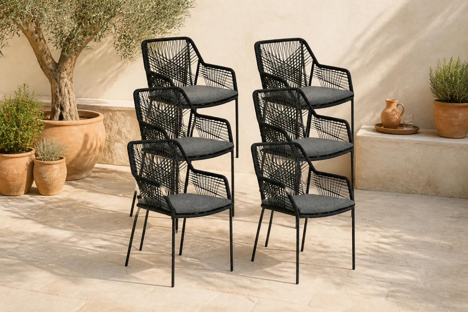 Sfeerfoto van BUITEN living Seville dining tuinstoel set van 8 | touw + staal | zwart